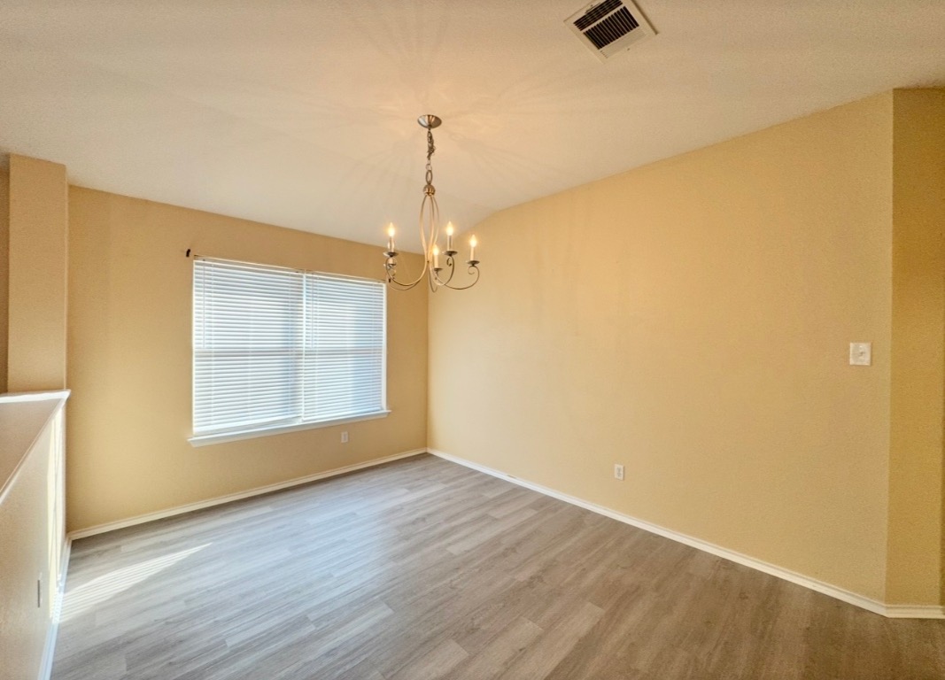 12809 Wood Lily Trail Elgin, TX 78621 - Photo 6 of 26 dining area featuring a chandelier
