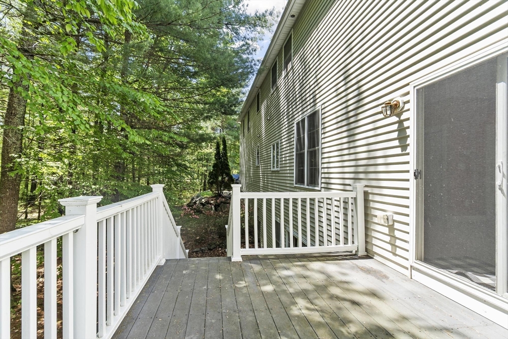 4 Forest Street Georgetown, MA 01833 - Photo 33 of 37 a view of backyard with deck and wooden floor