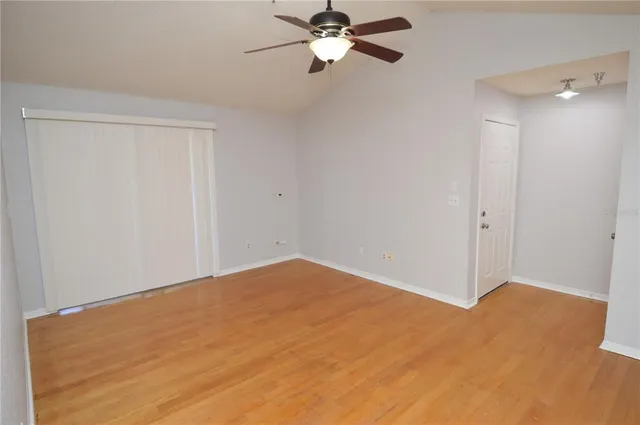 a bathroom with a granite countertop toilet and a sink