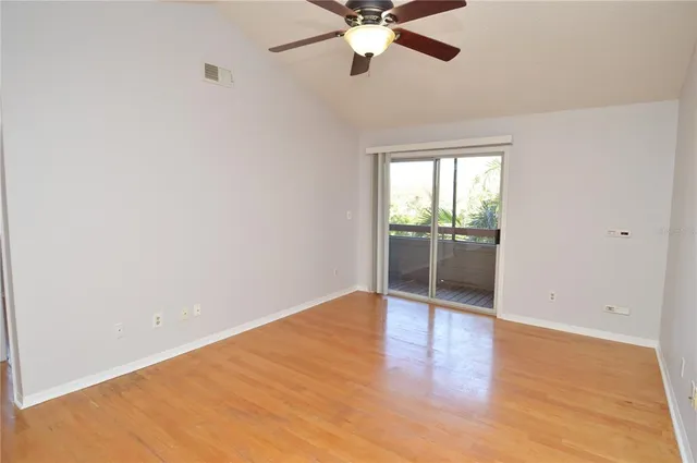 a view of an empty room with a fan