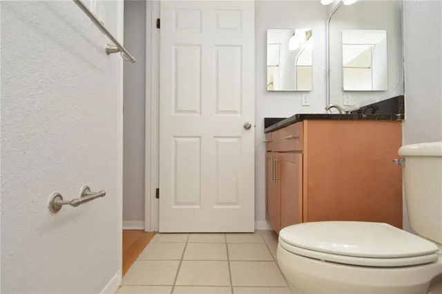 a view of a room with wooden floor and a sink