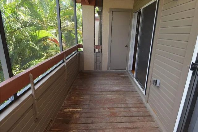 a view of a lake with a floor to ceiling window next to a lake