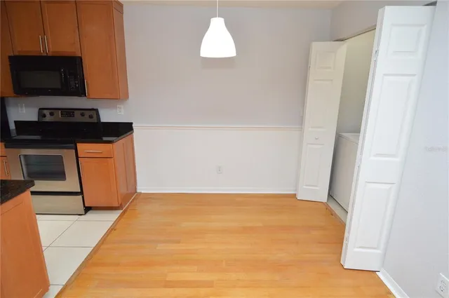 a view of empty room with ceiling fan