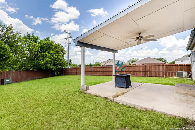 a view of a park with iron fence