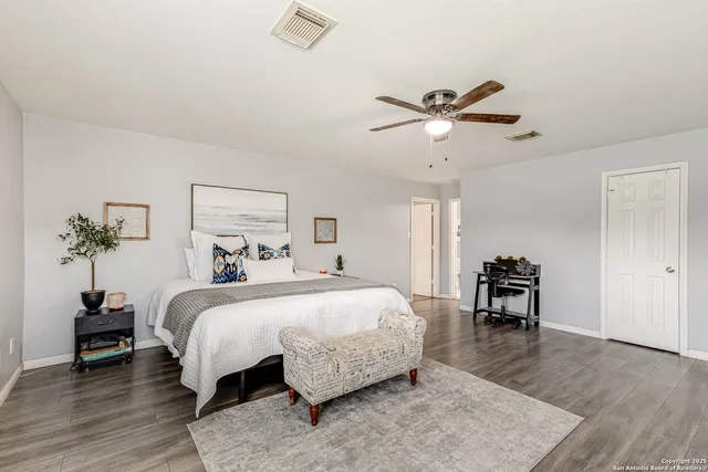 a bedroom with a bed and a table