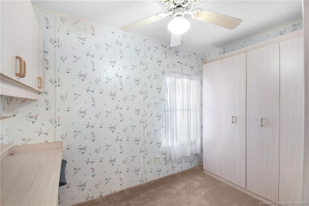 7149 Southeast Ridgeway Terrace Hobe Sound, FL 33455 - Photo 27 of 34 Bedroom with built in bed and desk