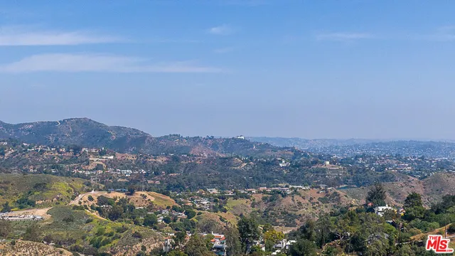 an aerial view of residential house and green space
