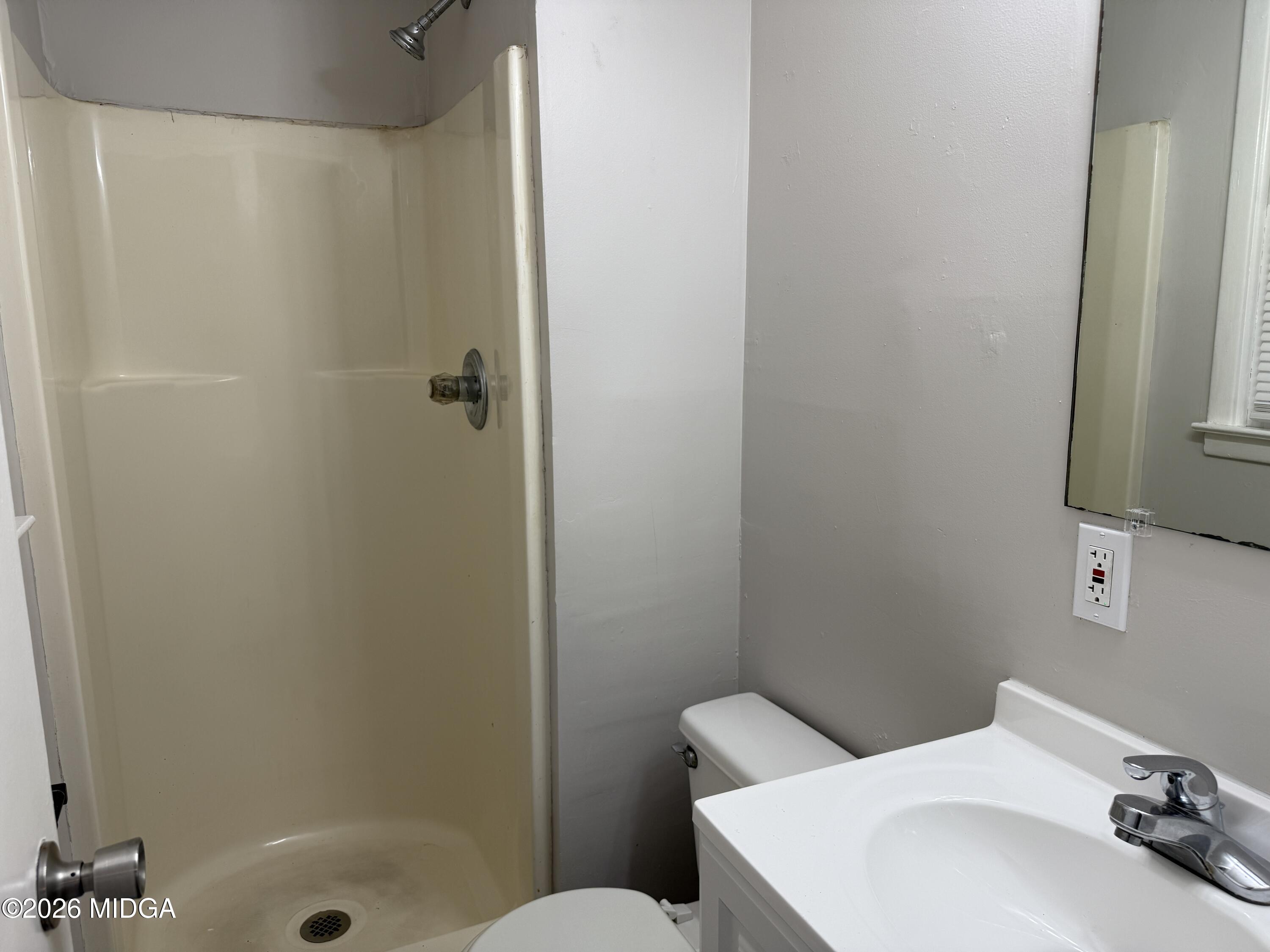 107 Miller Court Centerville, GA 31028 - Photo 13 of 16 a bathroom with a sink a toilet and shower