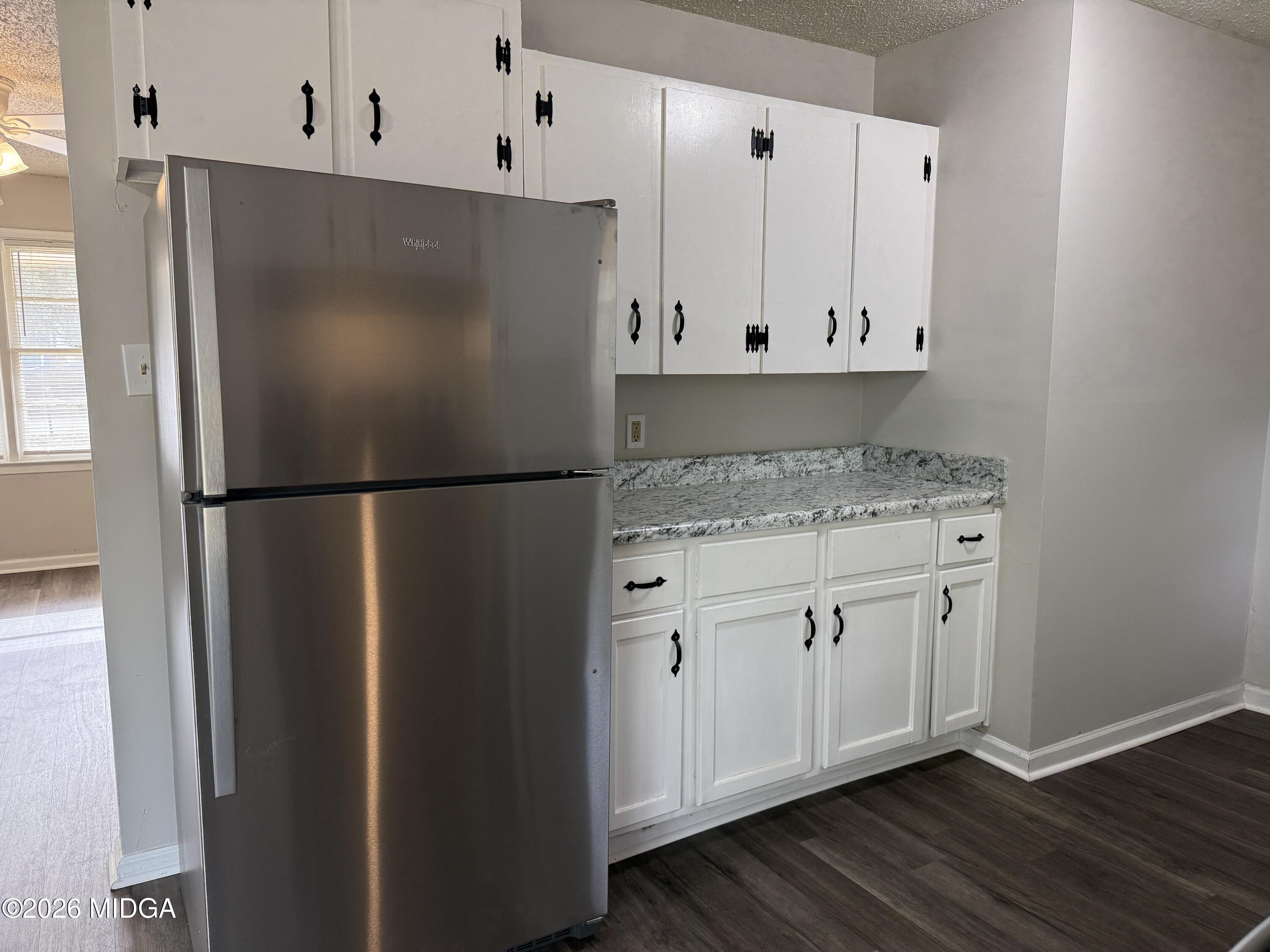 107 Miller Court Centerville, GA 31028 - Photo 6 of 16 a white refrigerator freezer sitting inside of a kitchen