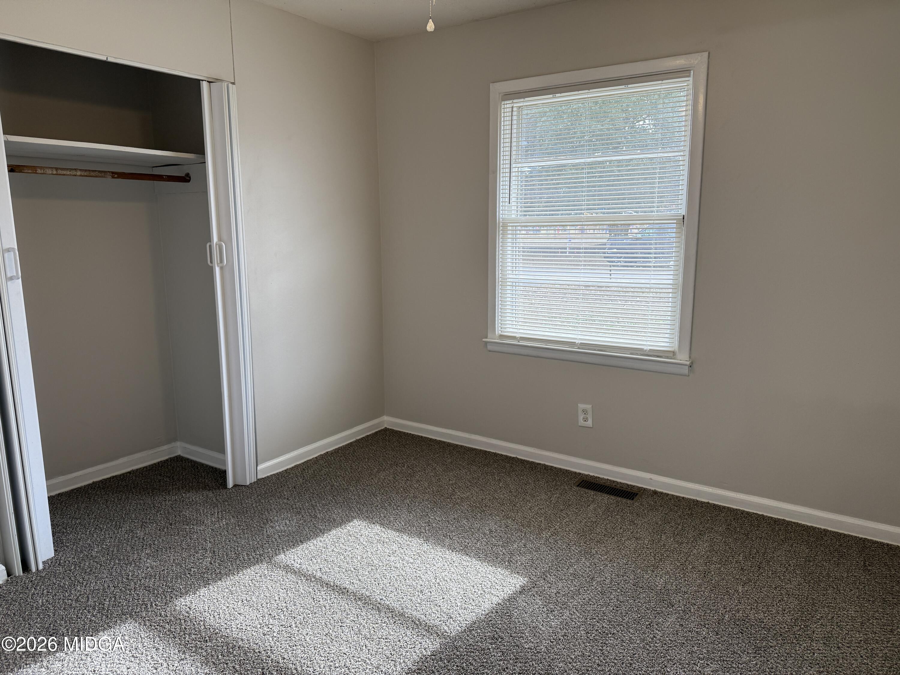 107 Miller Court Centerville, GA 31028 - Photo 8 of 16 an empty room with a window