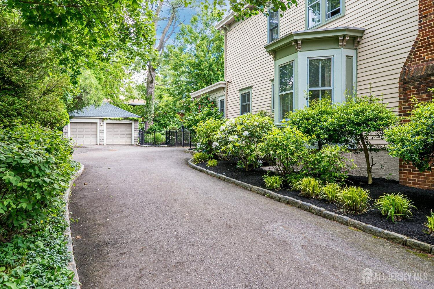 44 Rector Street Metuchen, NJ 08840 - Photo 12 of 65 a view of a house with a yard and potted plants