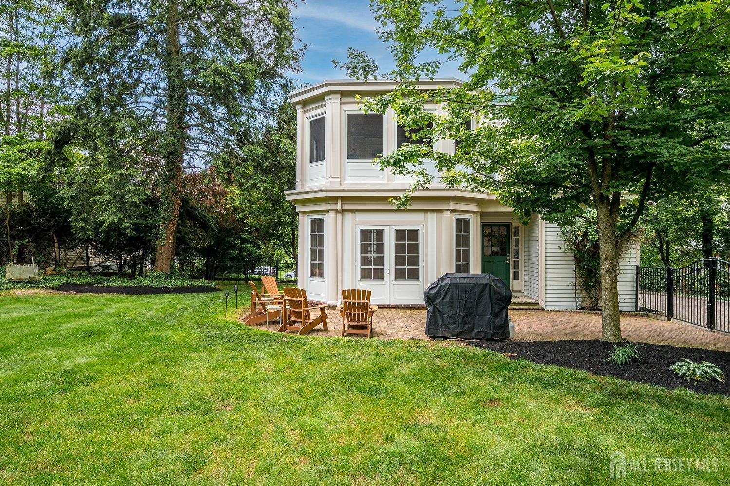 44 Rector Street Metuchen, NJ 08840 - Photo 16 of 65 a front view of a house with a garden and porch