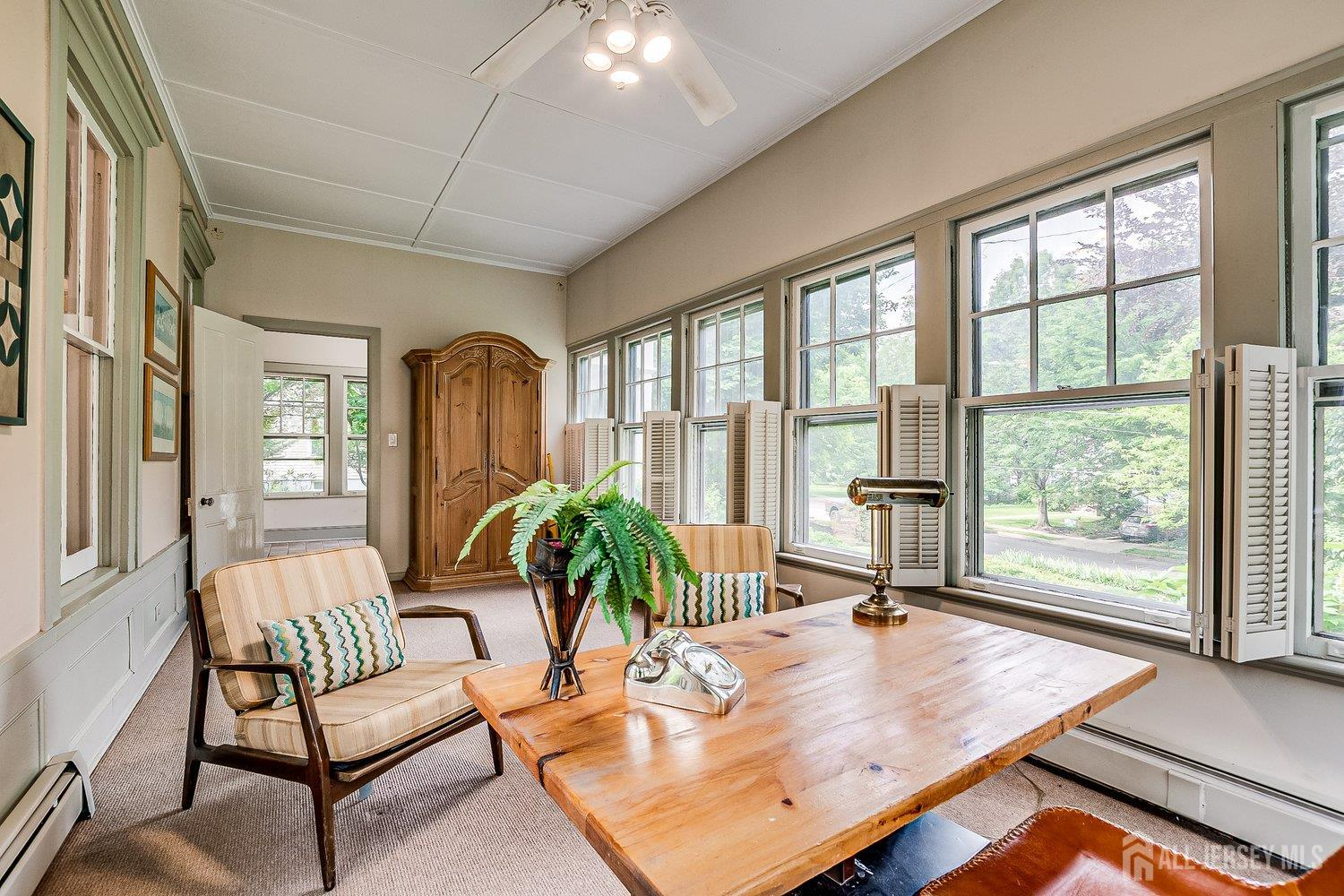 44 Rector Street Metuchen, NJ 08840 - Photo 27 of 65 a living room with furniture and a large window