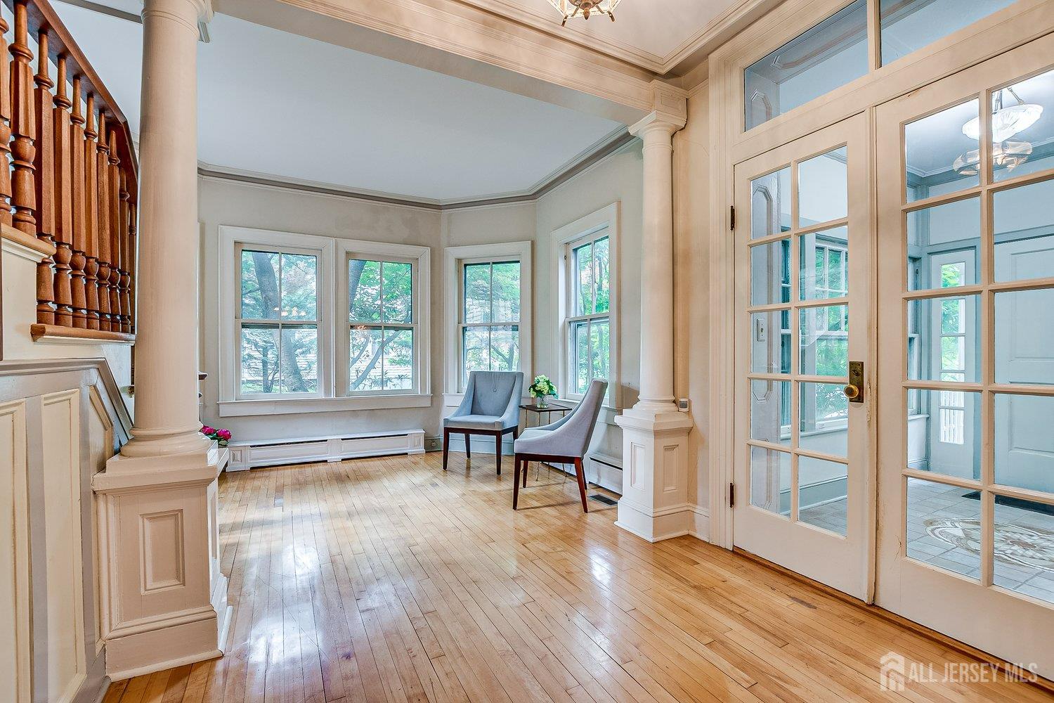 44 Rector Street Metuchen, NJ 08840 - Photo 30 of 65 a living room with furniture and floor to ceiling windows