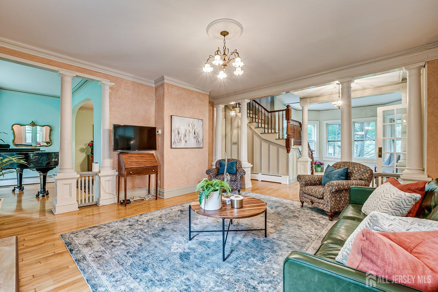 44 Rector Street Metuchen, NJ 08840 - Photo 35 of 65 a living room with furniture and a flat screen tv