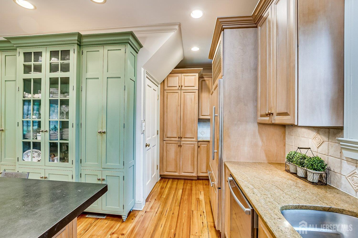 44 Rector Street Metuchen, NJ 08840 - Photo 43 of 65 a view of a kitchen with kitchen island a counter top space a sink and stainless steel appliances