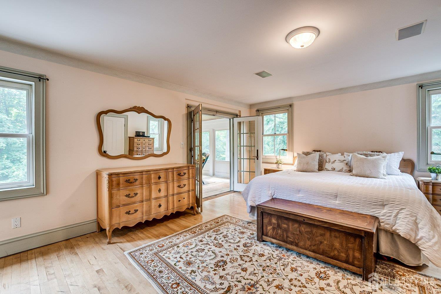 44 Rector Street Metuchen, NJ 08840 - Photo 48 of 65 a bedroom with a bed and wooden floor