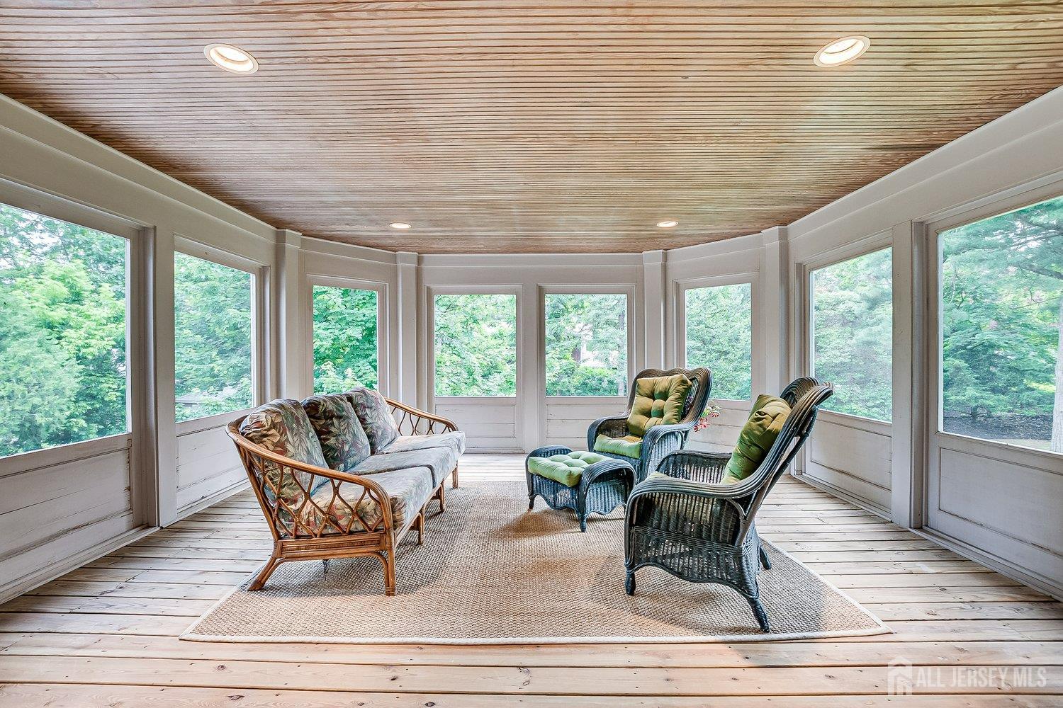 44 Rector Street Metuchen, NJ 08840 - Photo 49 of 65 a living room with furniture and a floor to ceiling window