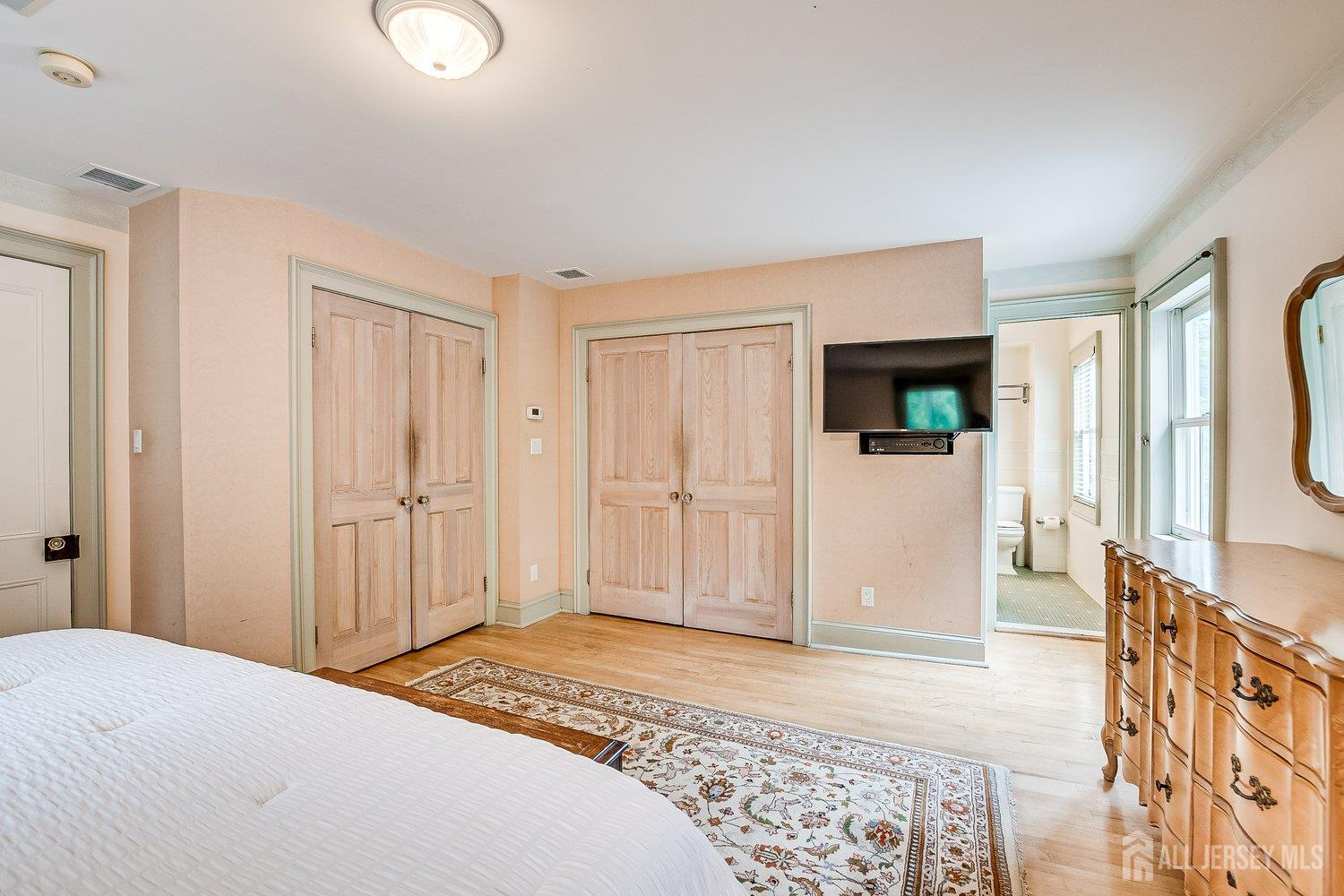 44 Rector Street Metuchen, NJ 08840 - Photo 50 of 65 a bedroom with a bed and a television