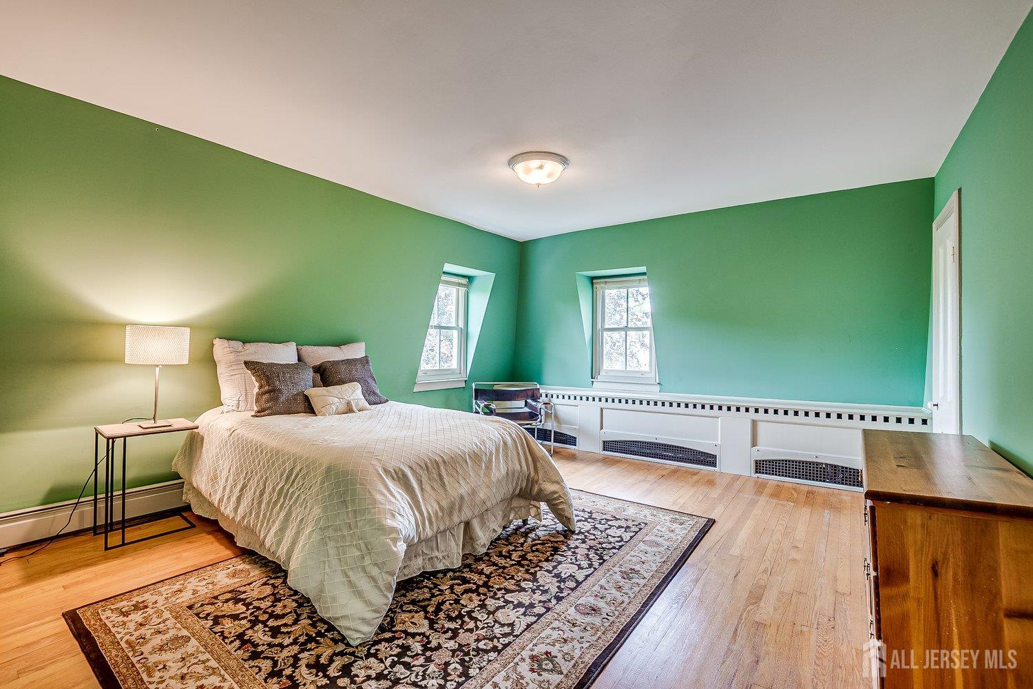 44 Rector Street Metuchen, NJ 08840 - Photo 60 of 65 a bedroom with a bed and a flat screen tv