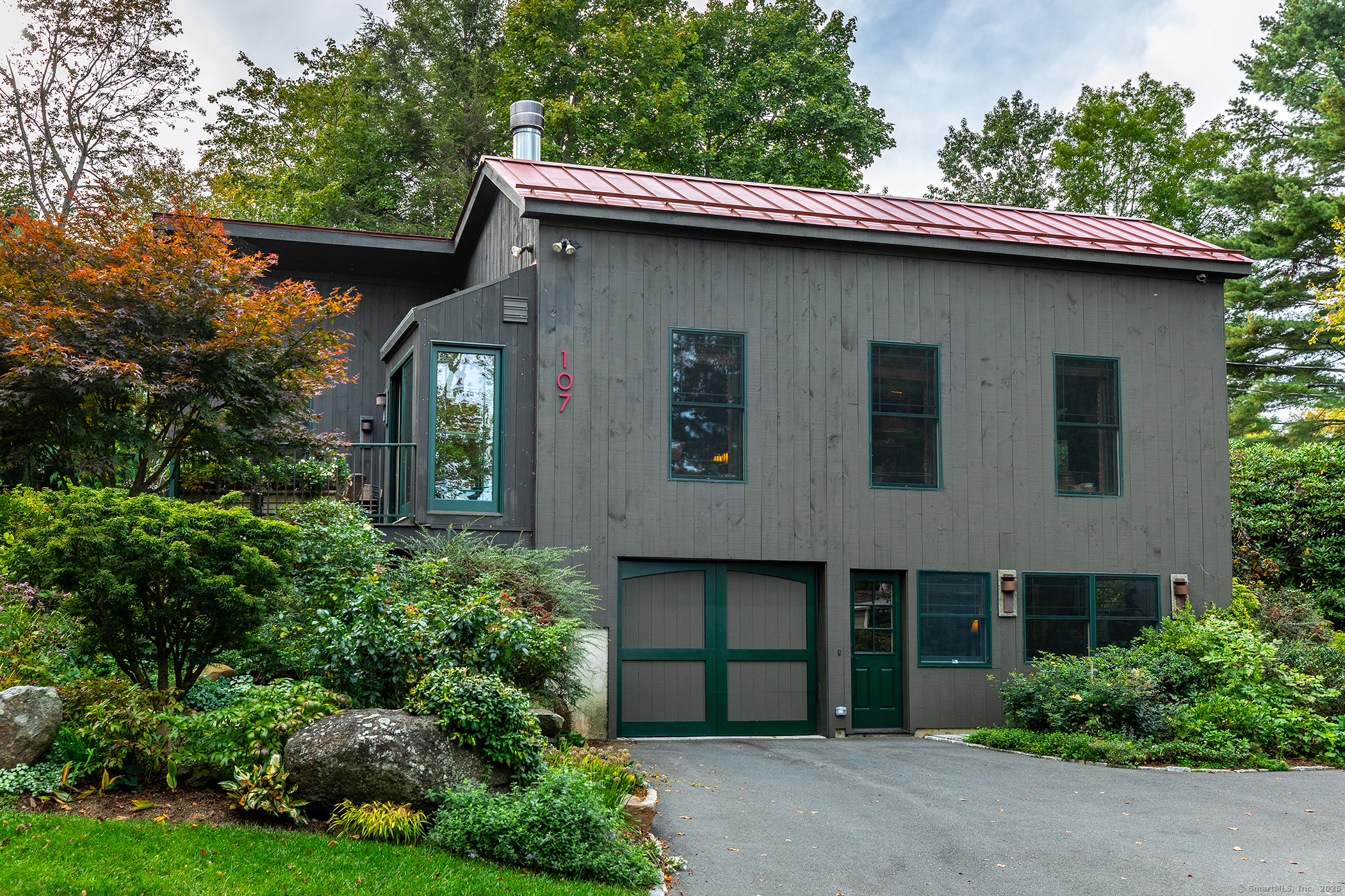 a front view of a house with garden