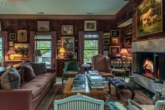 a living room with furniture a window and a fireplace
