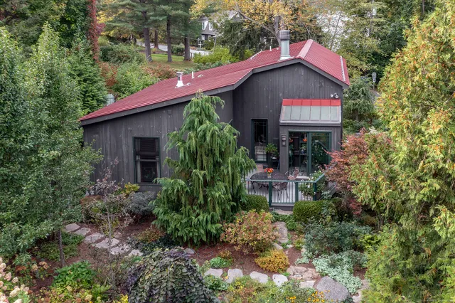 a front view of a house with garden