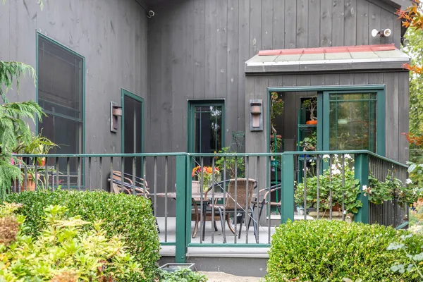 a view of a chair and table in the patio
