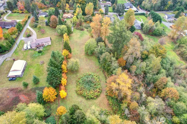 an aerial view of a house with swimming pool