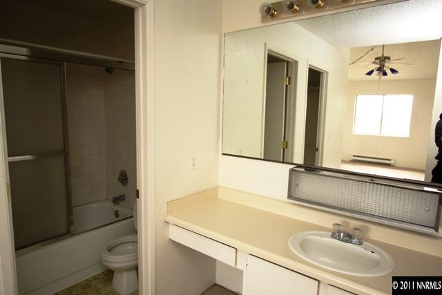2080 Highview Court, Unit 8 Reno, NV 89512 - Photo 8 of 11 a bathroom with a sink and a mirror