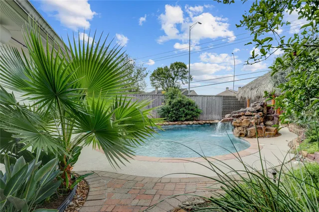 a couple of palm trees in front of yellow room