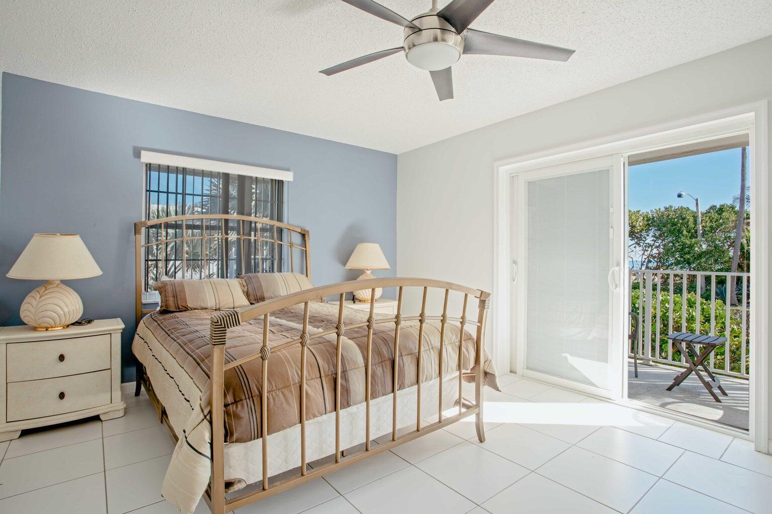 5500 Old Ocean Boulevard, Unit 210 Ocean Ridge, FL 33435 - Photo 17 of 27 a bed sitting in a bedroom next to a window