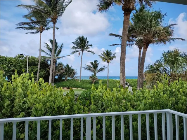a living room with furniture a rug and a flat screen tv