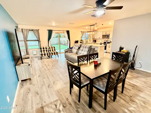 a view of a dining room with furniture window and outside view