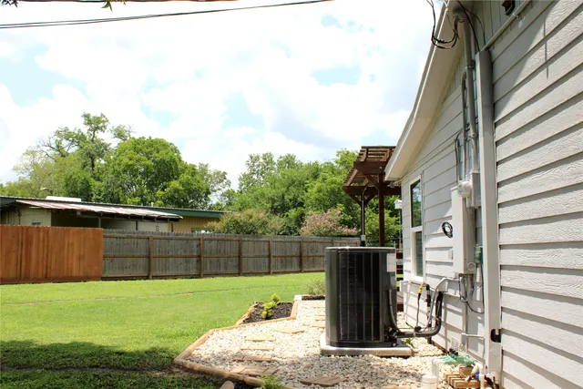 a view of a house with a yard and sitting area