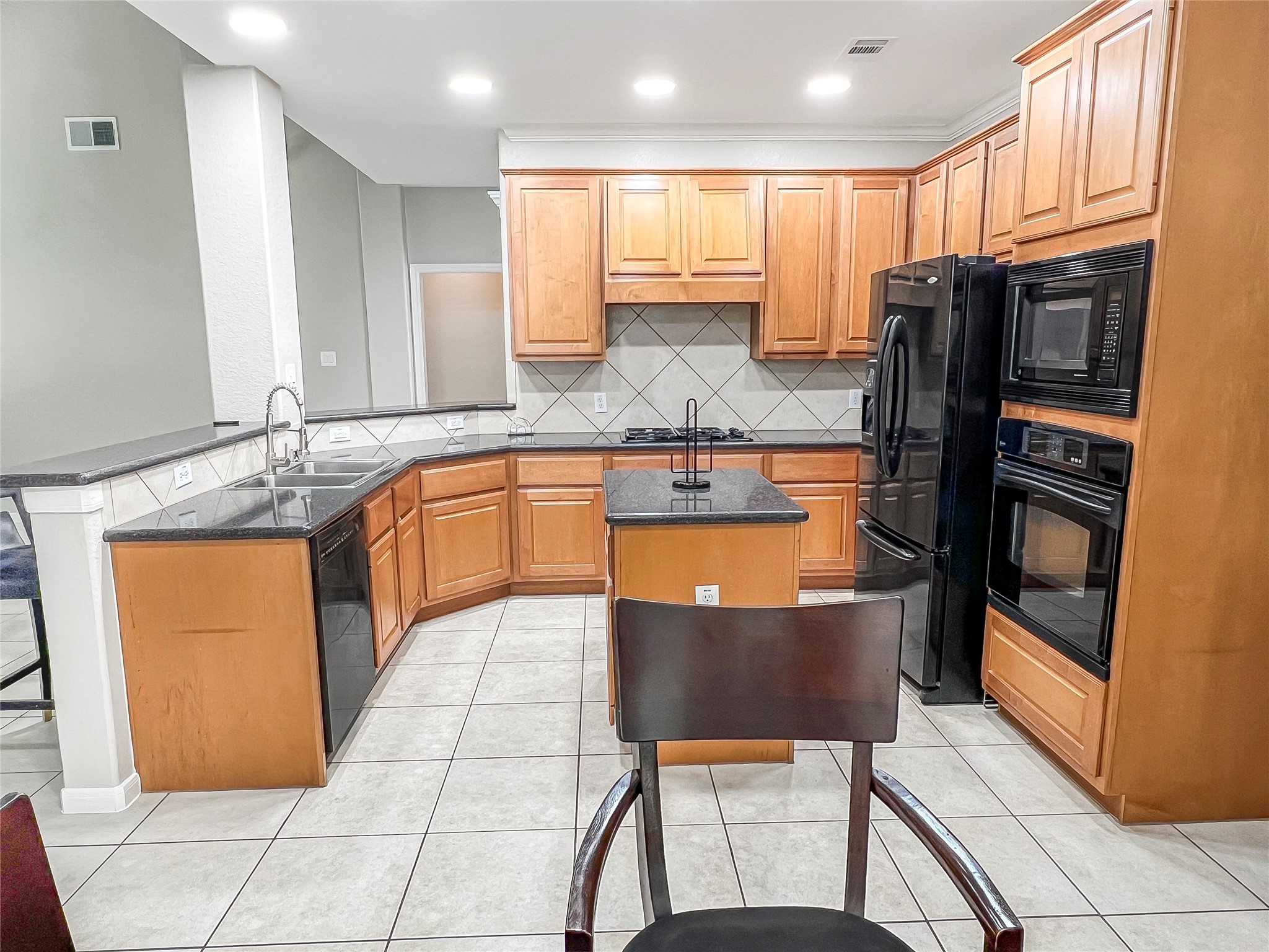 519 Savannah Springs Way Spring, TX 77373 - Photo 11 of 22 a kitchen with stainless steel appliances granite countertop a refrigerator sink and stove