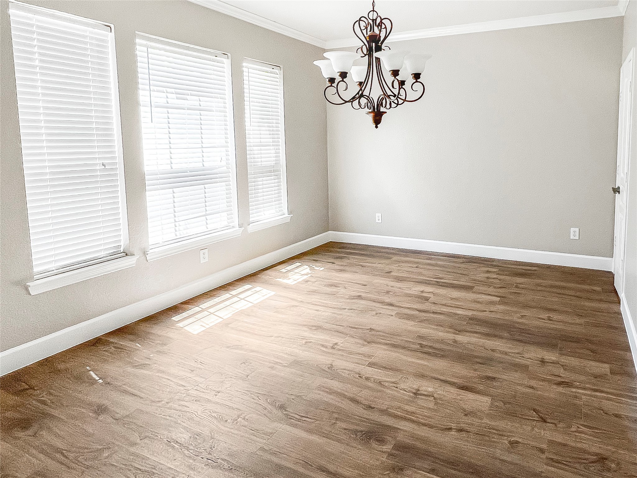 519 Savannah Springs Way Spring, TX 77373 - Photo 14 of 22 a view of an empty room with wooden floor and a window