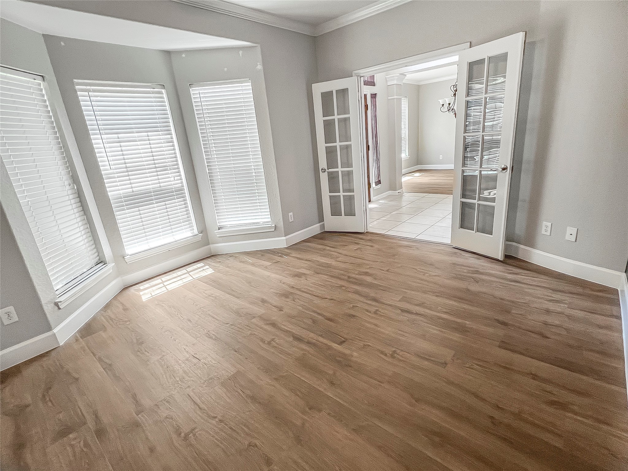 519 Savannah Springs Way Spring, TX 77373 - Photo 15 of 22 a view of an empty room with wooden floor and a window