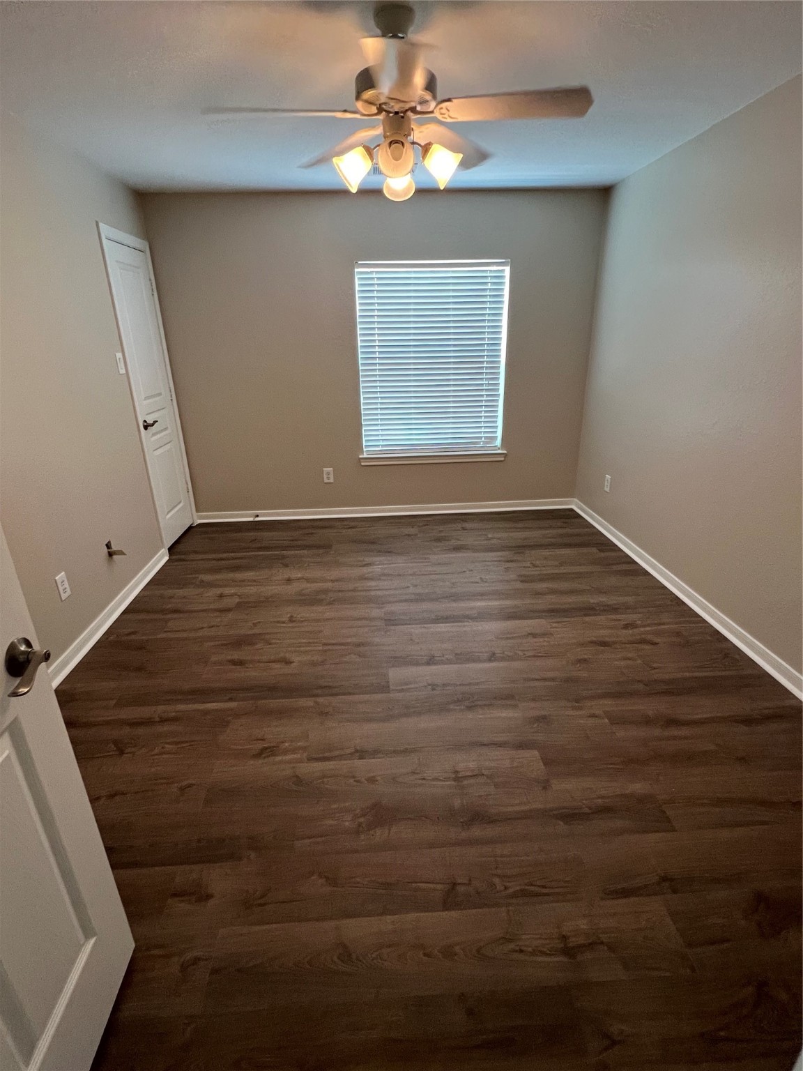 519 Savannah Springs Way Spring, TX 77373 - Photo 17 of 22 a view of an empty room with window and wooden floor