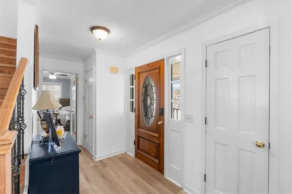 a view of a livingroom with wooden floor and closet