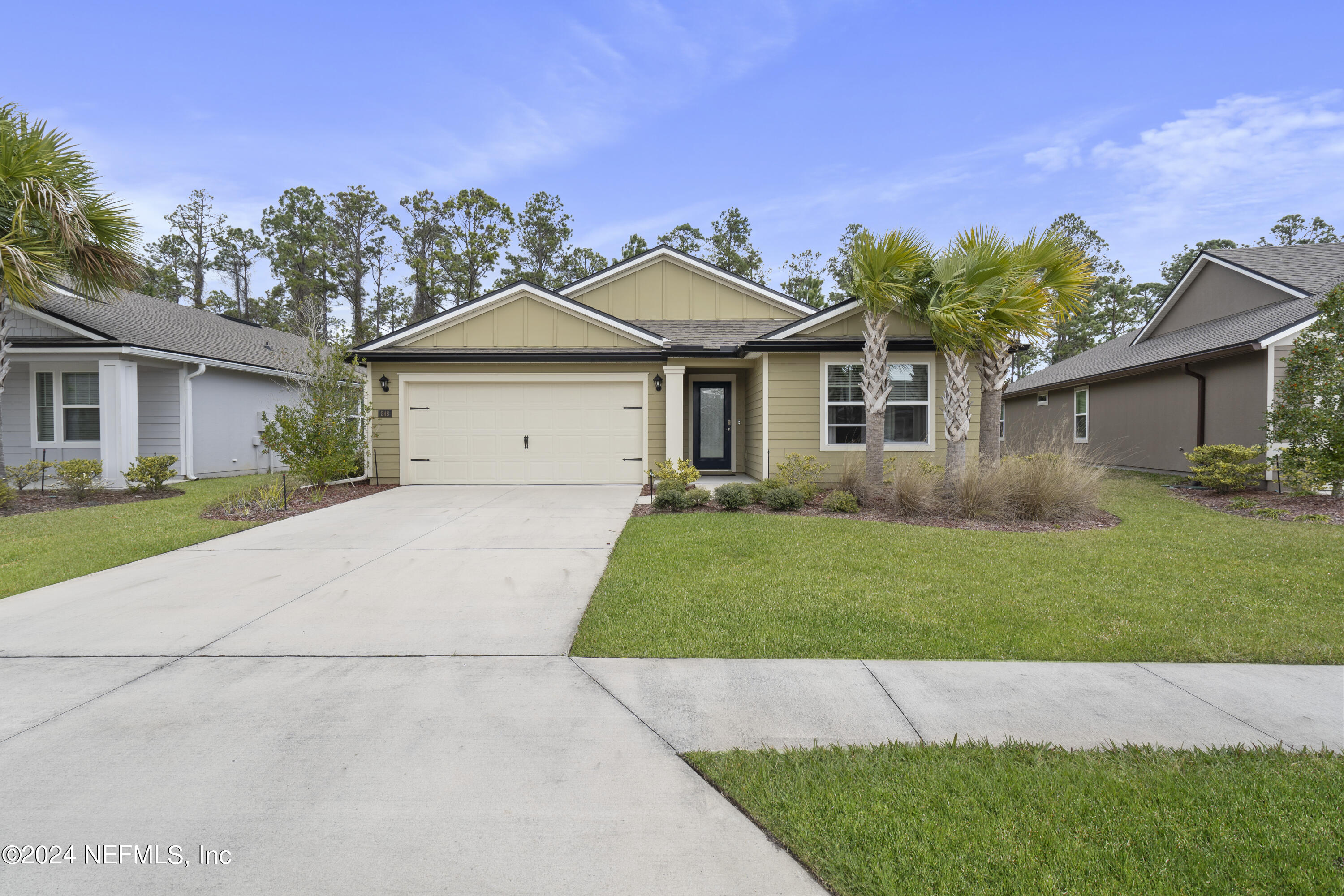 548 Palace Drive St. Augustine, FL 32084 - Photo 13 of 19 a front view of a house with a garden and deck