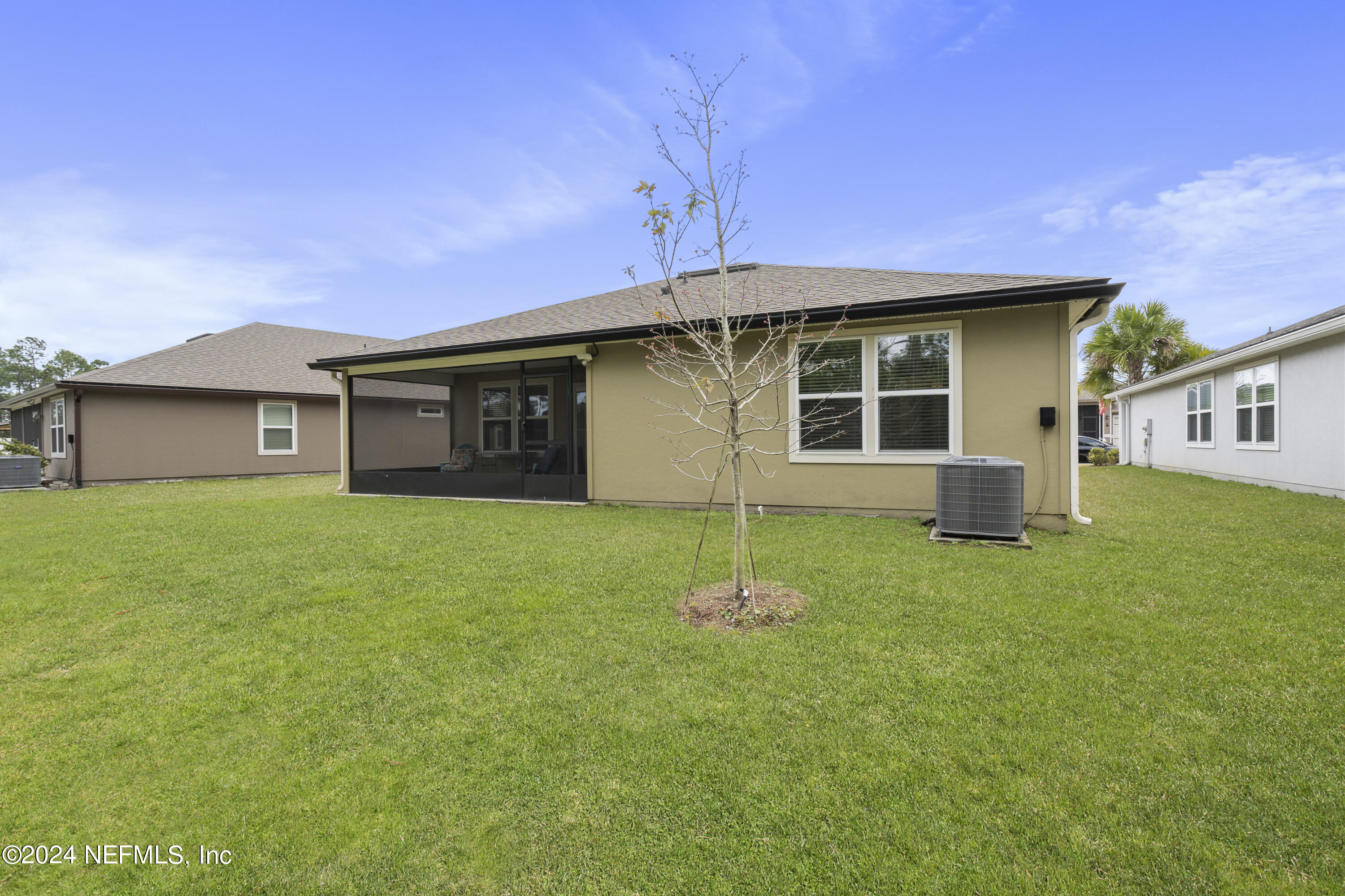 548 Palace Drive St. Augustine, FL 32084 - Photo 17 of 19 a house that has a big yard with wooden fence