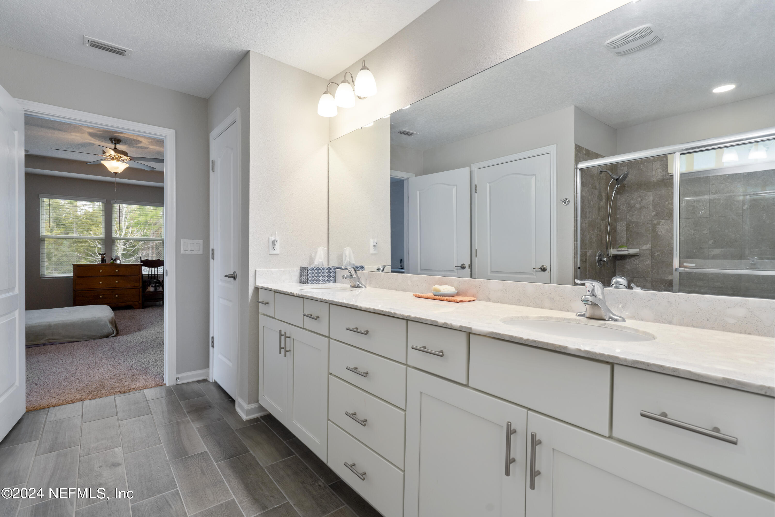 548 Palace Drive St. Augustine, FL 32084 - Photo 6 of 19 a bathroom with a sink double vanity and a mirror