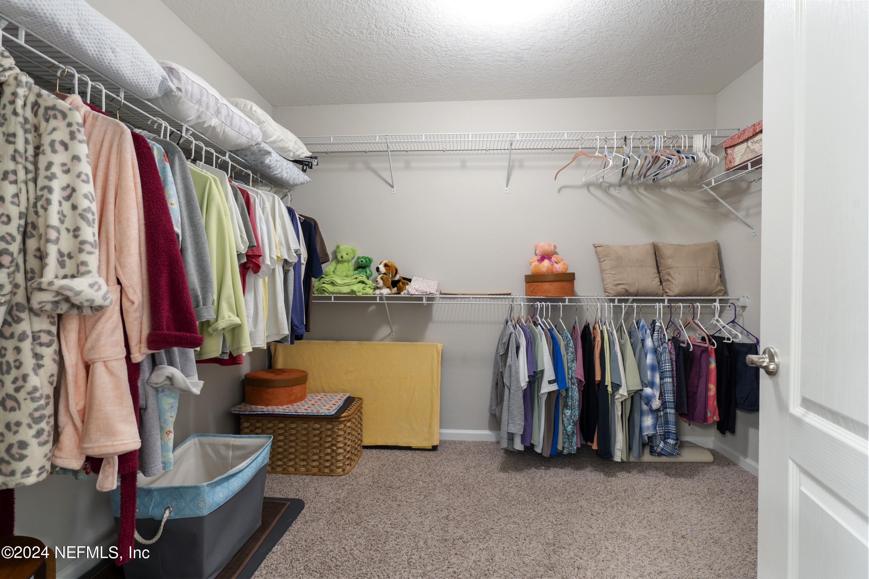 548 Palace Drive St. Augustine, FL 32084 - Photo 7 of 19 a view of walk in closet with clothes and shoes