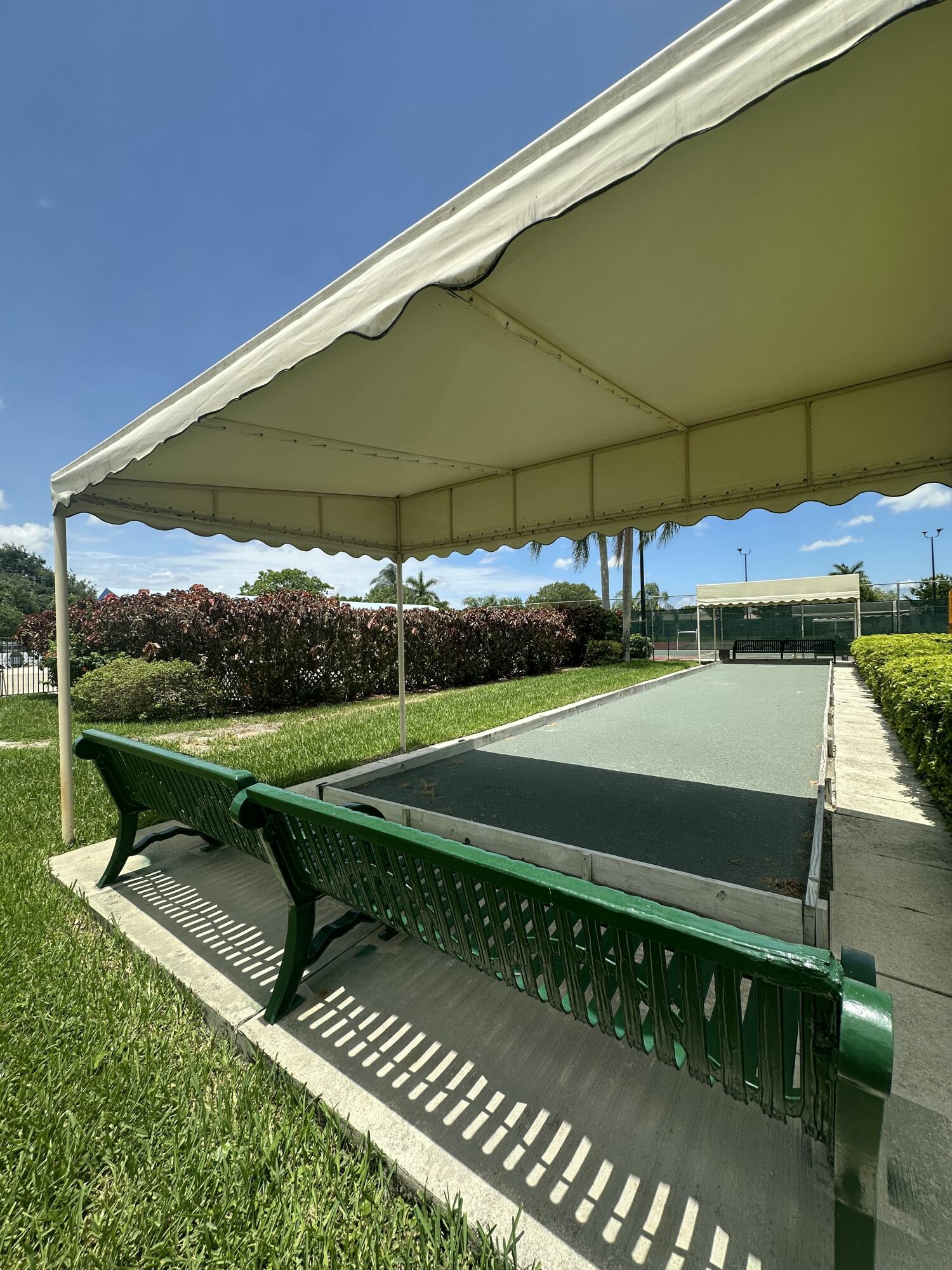 18900 Stewart Circle, Unit 7 Boca Raton, FL 33496 - Photo 19 of 23 a view of a yard with an outdoor space