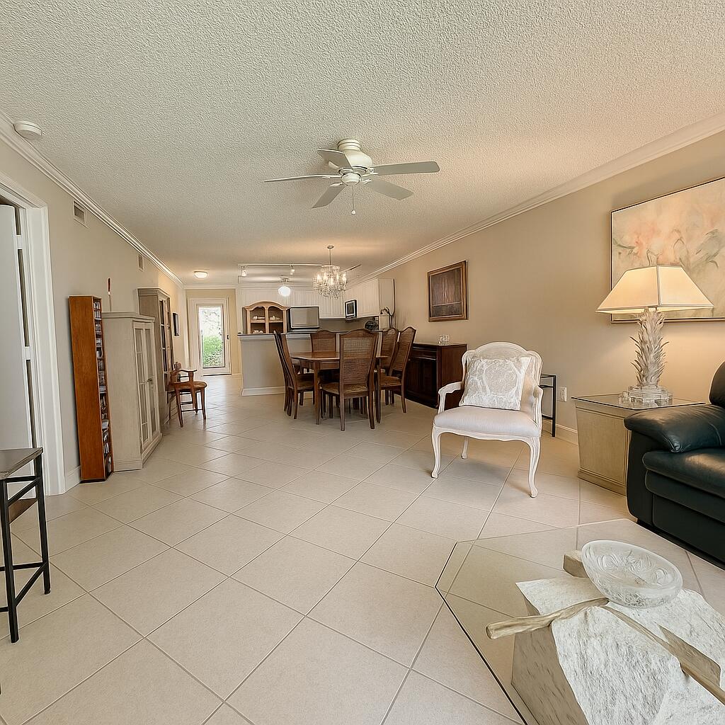 18900 Stewart Circle, Unit 7 Boca Raton, FL 33496 - Photo 4 of 23 a living room with furniture and white walls