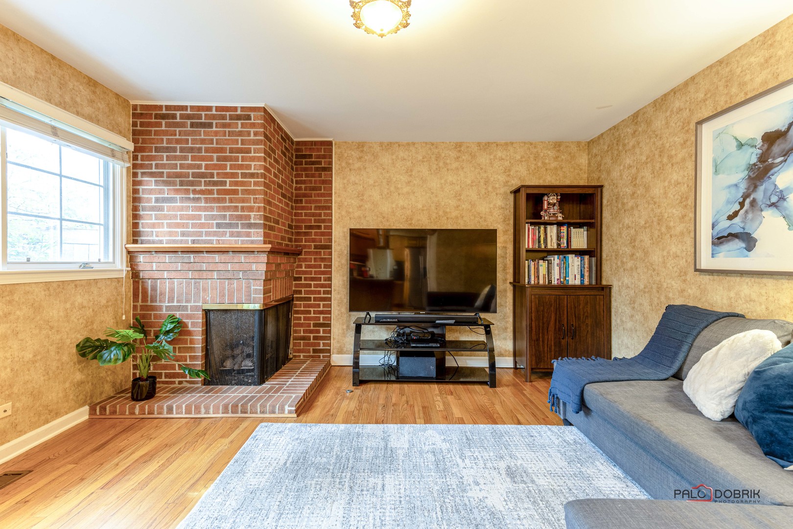 757 Hibbard Road Wilmette, IL 60091 - Photo 12 of 28 a living room with furniture and a flat screen tv