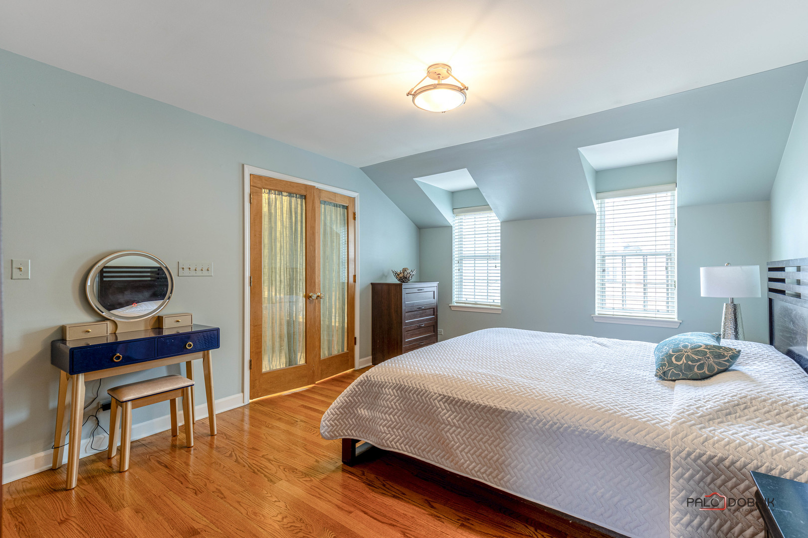 757 Hibbard Road Wilmette, IL 60091 - Photo 15 of 28 a bedroom with a bed a table and a dresser