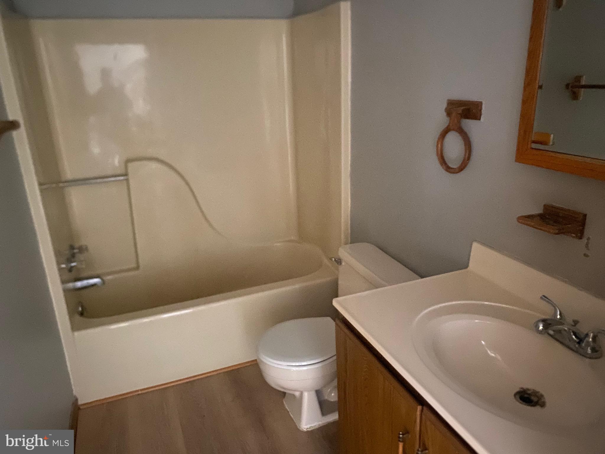 113 Frank Street, Unit 6 Dunmore, PA 18512 - Photo 6 of 6 a bathroom with a sink a toilet and shower