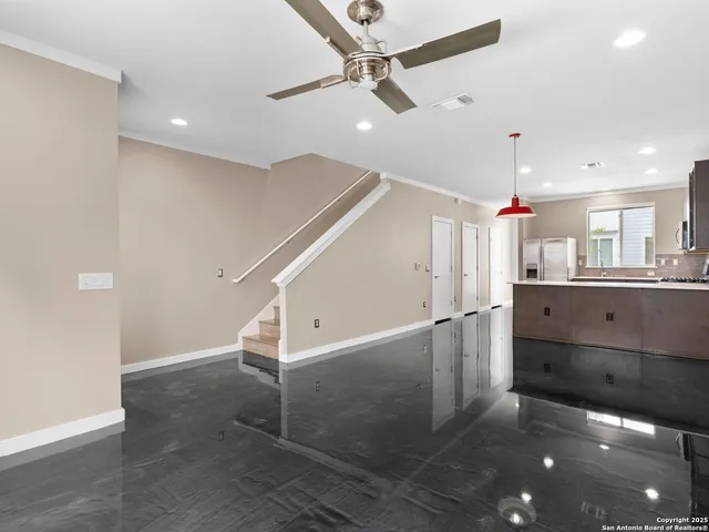 a view of a kitchen with a sink and a window